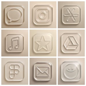 May include: Nine clear, square-shaped icons with embossed designs. The icons include a speech bubble, Instagram logo, a star, a musical note, a Google Drive logo, a Blackberry logo, an email symbol, and a smiley face.