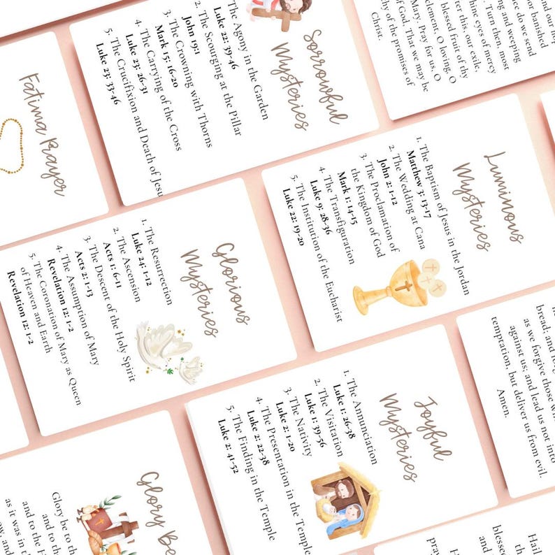 May include: A set of prayer cards with the text "Sorrowful Mysteries," "Luminous Mysteries," "Glorious Mysteries," and "Joyful Mysteries." Each card features religious illustrations and Bible verses. The cards are on a light pink background.