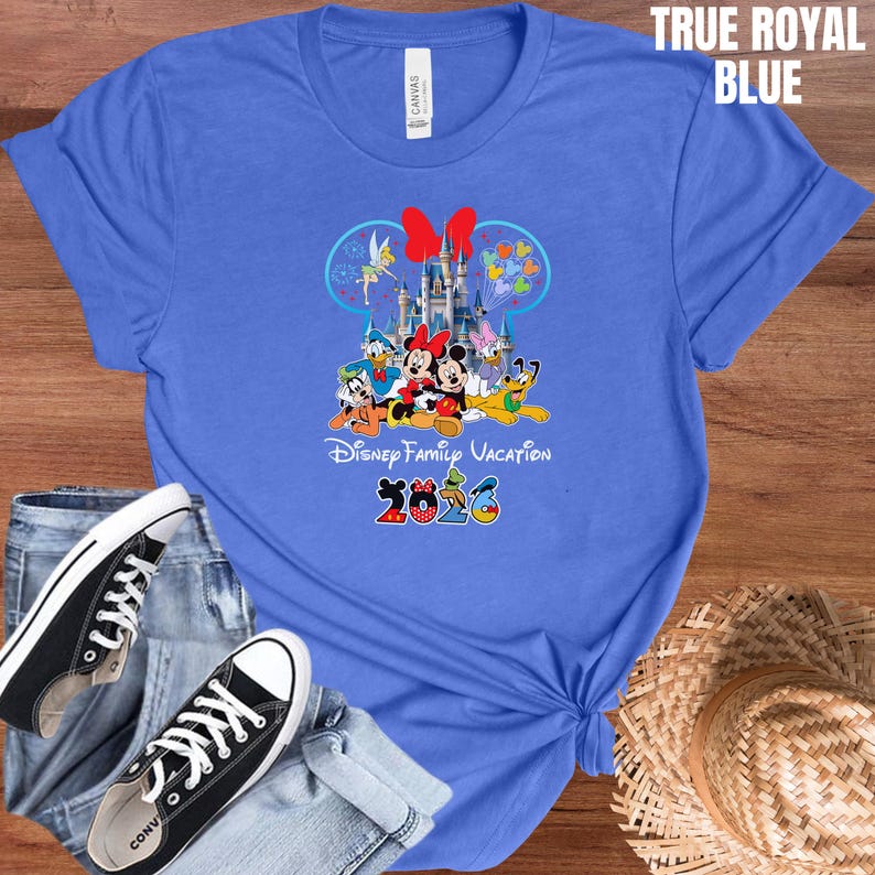 May include: A white ceramic mug with a black handle and the text "But First, Coffee" in a handwritten style. The mug is on a white surface. The mug is approximately 4 inches tall.