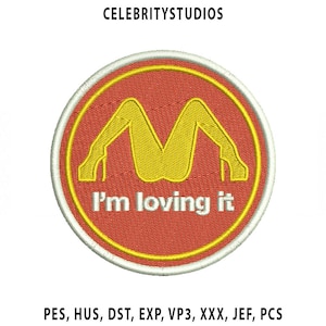 May include: Embroidered patch featuring a red circle with a yellow border. Inside, a yellow stylized image of legs in high heels forms an "M" shape. The text "I'm loving it" is below the image. The text "CELEBRITYSTUDIOS" is at the top.