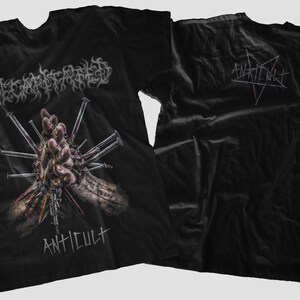 May include: Black t-shirt featuring the band name "Decapitated" in a gothic font above a graphic of a hand pierced with nails. The word "ANTICULT" is printed below the graphic. The back of the shirt displays the word "ANTICULT" and a pentagram.