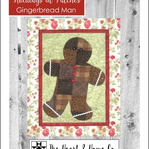 May include: A gingerbread man quilt pattern with a brown gingerbread man on a green background. The pattern is surrounded by a red and white floral border. The title of the pattern is "Holidays in Patches Gingerbread Man" and the pattern number is "HNH11".