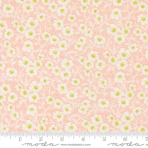 May include: A floral fabric with a repeating pattern of white daisies with yellow centers and green accents on a light peach background. The fabric has a dotted texture and is suitable for quilting or other craft projects.