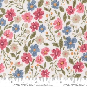 May include: Floral fabric with a white background, featuring pink, blue, and tan flowers, along with green leaves and stems. The fabric has a repeating pattern of various flower sizes and shapes. The bottom edge has a ruler with inch markings.