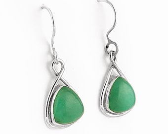 May include: A pair of silver dangle earrings with green gemstone drops. The earrings have a twisted wire design.