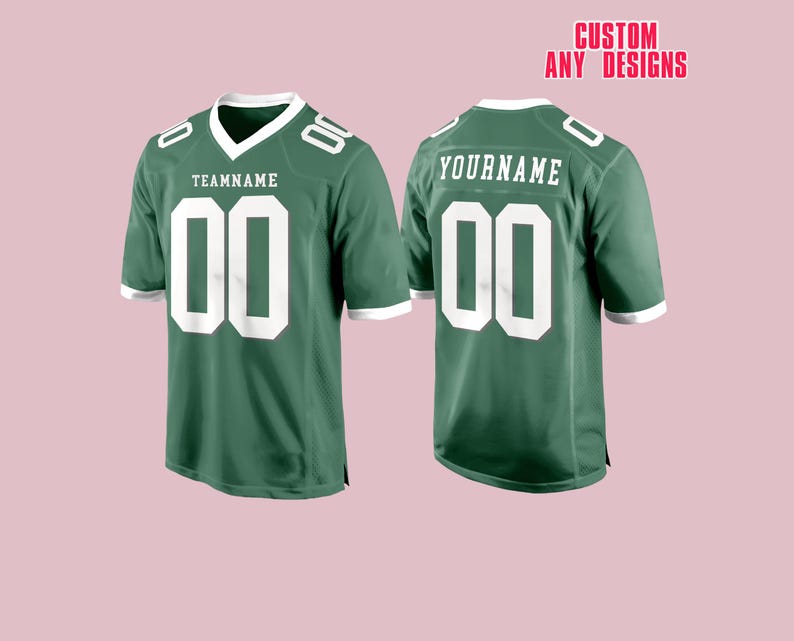 May include: Two green football jerseys with white accents. The front jersey has "TEAMNAME" above the number "00". The back jersey has "YOURNAME" above the number "00". The text "CUSTOM ANY DESIGNS" is in the top right corner.