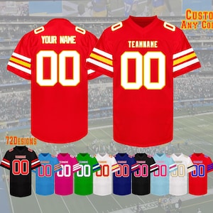 May include: Red football jersey with white and yellow accents, featuring the number "00" in white with a yellow outline. The jersey has "YOUR NAME" printed above the number. Additional jerseys in various colors are displayed.