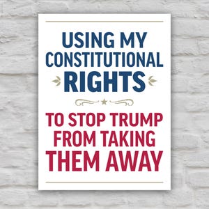 Color version of protest sign with bold uppercase text that reads "Using my constitutional rights to stop Trump from taking them away."