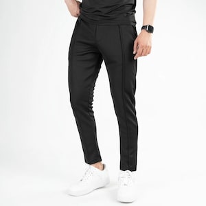 Pantalones ajustados con costura delantera