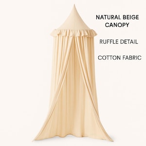 May include: A natural beige cotton fabric canopy featuring a pointed top and a ruffle detail around the upper edge. The text NATURAL BEIGE CANOPY, RUFFLE DETAIL, and COTTON FABRIC is displayed on the right side of the hanging fabric structure.