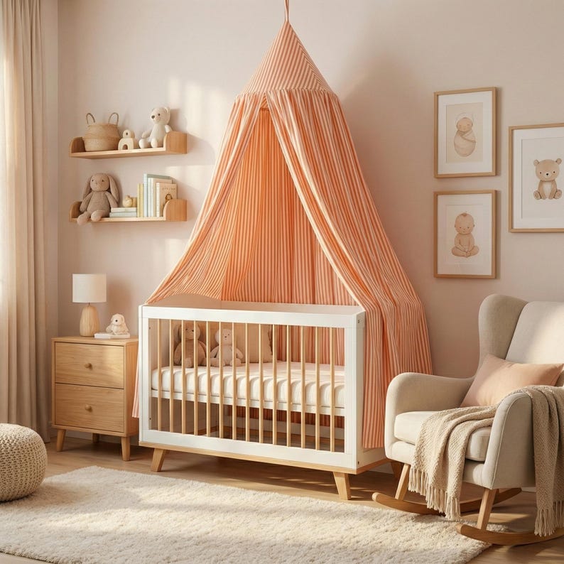 May include: A white wooden crib with light wood legs and a white mattress, featuring a hanging canopy made of orange and white striped fabric. The canopy is suspended from the ceiling and drapes over the crib, creating a soft, enclosed space.