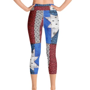 May include: Capri leggings featuring a patchwork design with red, white, and blue sections. The pattern includes floral motifs, star shapes, and swirling lines across the fabric. The leggings have a high waistband and reach mid-calf length.