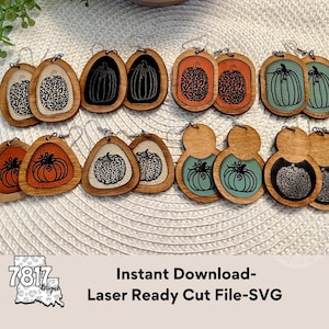 May include: A set of 10 laser cut wooden pumpkin earrings in various designs. The earrings are in a variety of colours, including black, white, orange, green, and brown. The earrings are perfect for autumn and Halloween.