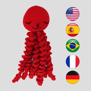 Pode incluir: Um brinquedo de polvo vermelho de crochê feito à mão, com um rosto sorridente e tentáculos encaracolados. O brinquedo de pelúcia macio é adequado para crianças. O polvo é feito de fio e tem um tom vermelho vibrante.