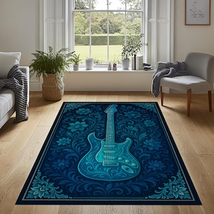 May include: A rectangular area rug featuring a stylized electric guitar in shades of blue. The guitar is centered on a dark blue background with a floral pattern. The rug has a decorative border.