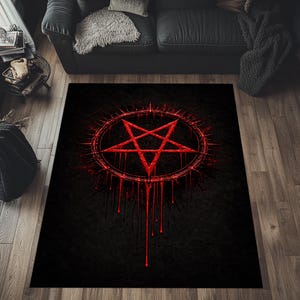 May include: Black area rug featuring a red pentagram design with a dripping blood effect. The rug has a dark, gothic aesthetic, with a star symbol inside a circle, and is suitable for a living room or bedroom.