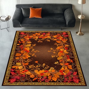 May include: A rectangular rug with a fall-themed design. The rug features a dark brown centre with a border of autumn leaves in shades of red, orange, and yellow. The border has a gold ornate design.