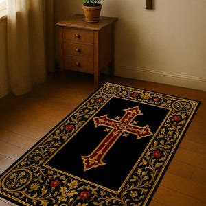May include: A rectangular black rug with a large red and gold cross design in the center. The rug has a gold floral border with red accents. A wooden cross hangs on the wall above the rug.