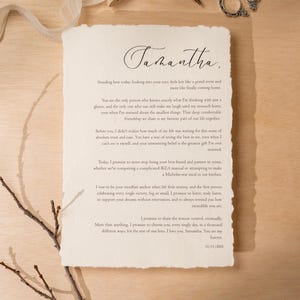 May include: A handwritten letter on textured paper with the name "Samantha" in elegant script. The letter features a heartfelt message, with a torn edge, and is set against a light wooden surface. A sprig and ribbon add to the aesthetic.