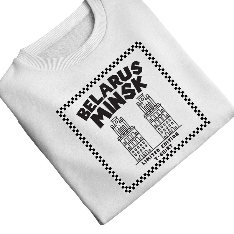 May include: White sweatshirt featuring a black and white graphic. The graphic includes the words "BELARUS MINSK" and two stylized building illustrations within a checkered border. The text "LIMITED EDITION T-SHIRT" is also present.