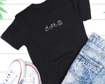 White T-Shirt with Bubble Tea Bicycle and Backpack Icons | Minimalist Travel Tee | Gift for Adventure Lovers Unisex