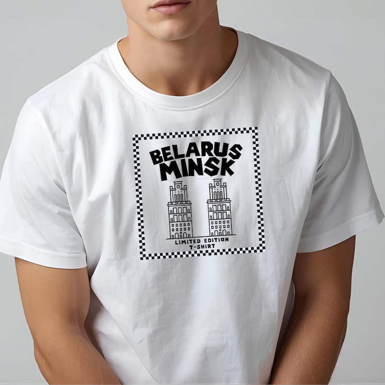 May include: White t-shirt featuring a black and white graphic of two buildings with the text "BELARUS MINSK" above and "LIMITED EDITION T-SHIRT" below. The design is framed by a checkered border.