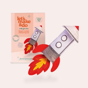 May include: A space rocket colouring kit with the text "let's make & do" and "Space rocket colouring kit". The kit includes a DIY rocket with red flames and a white and grey rocket body. The box has the text "easy peasy for beginners".