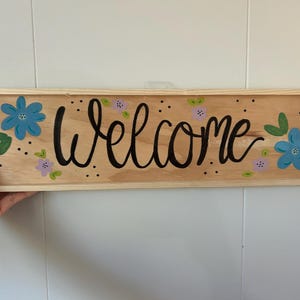 Panneau de bienvenue peint à la main