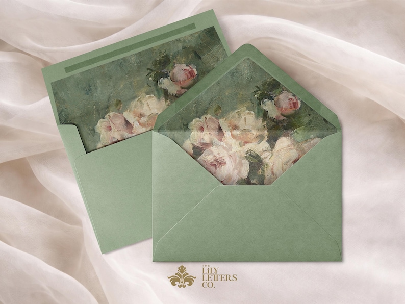 Puede incluir: Dos sobres verde salvia con ilustraciones florales. Los sobres est&aacute;n abiertos, revelando una pintura de acuarela de rosas rosas y blancas. El logotipo de The Lily Letters Co. est&aacute; en la parte inferior. El fondo es una tela suave blanquecina.