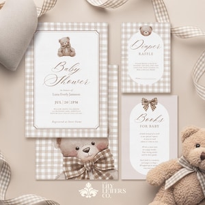 May include: Baby shower invitation and cards with a teddy bear theme. The invitation features the text "Baby Shower" and event details. Other cards include "Diaper Raffle" and "Books for Baby". A plush heart and teddy bear are also present.