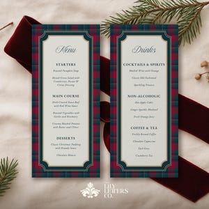 May include: Two rectangular menu cards with a plaid design in red, green, and navy blue. The cards feature menu options for starters, main courses, desserts, cocktails, and non-alcoholic drinks. A burgundy ribbon and sprigs of greenery decorate the background.