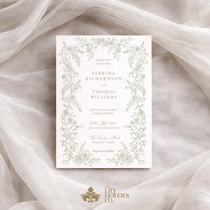 Puede incluir: Una invitaci&oacute;n de boda crema con un borde floral verde y los nombres Sabrina Richardson y Thomas Williams. La fecha es el 20 de junio de 2026. El texto incluye 'The Savannah Hall, Savannah, Georgia'.