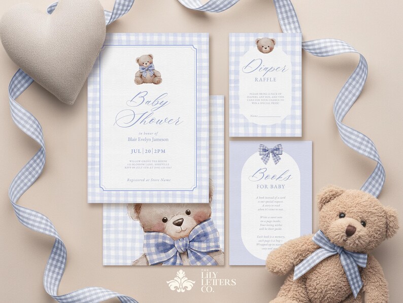 May include: A baby shower invitation set with a teddy bear theme. The invitation, diaper raffle, and book request cards feature a blue and white gingham pattern and teddy bear illustrations. A plush teddy bear and heart-shaped pillow are also present.
