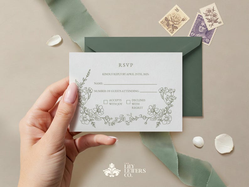 May include: A light gray RSVP card with floral illustrations and the text "RSVP". The card is held near a green envelope and ribbon. Two vintage stamps and decorative elements are also present. The Lily Letters Co. logo is at the bottom.