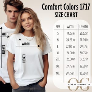 May include: A size chart for Comfort Colors 1717 t-shirts. The chart shows the width and length measurements in inches for sizes S through 4XL. Two people are wearing white t-shirts. The Olive Custom Gift logo is at the bottom.
