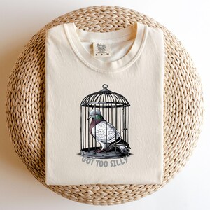 Quirky Graphic Tee,Got Too Silly T Shirt, Pigeon Trapped in Cage Design,Funny Cartoon Bird Tee, Unique Animal Lovers Gift,Bird Lover Apparel