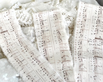 Hand Torn Music Notes on Cream Fabric Strips 2"