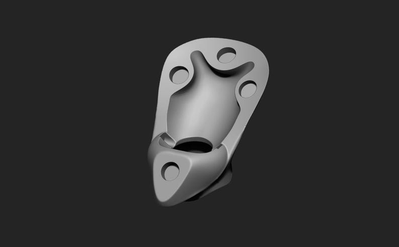 May include: A gray, abstract, 3D-rendered object with a rounded, elongated shape. It features multiple circular and curved openings, and a smooth, matte finish. The object is set against a dark gray background.