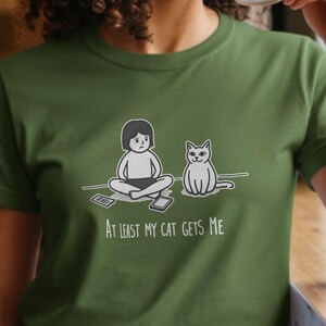 At Least My Cat Gets Me T-Shirts, Cat Lover Tees, Introvert T-Shirt With Funny Cartoon Cat Design, Pet Owner Shirt Gift For Awkward Cat Mom