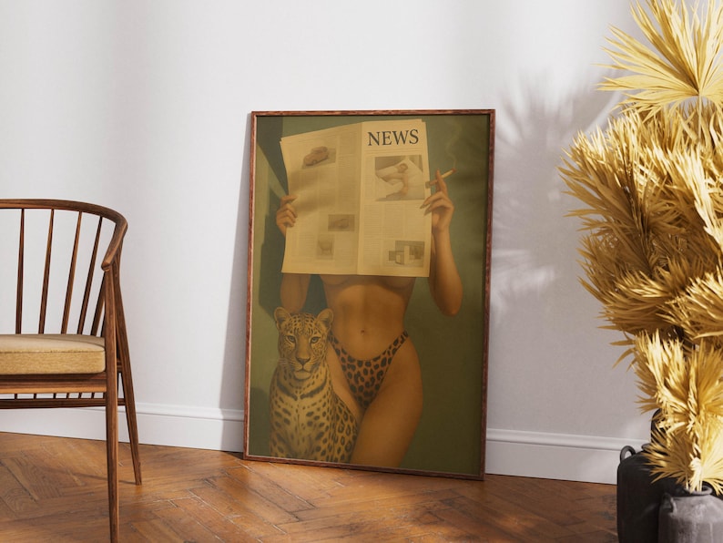 May include: A framed print featuring a woman holding a newspaper with the headline "NEWS". The woman is wearing leopard print underwear and is accompanied by a leopard. The print has a vintage aesthetic.