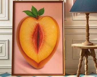 May include: A framed artwork featuring a realistic depiction of a peach cut in half, revealing its interior. The peach is a vibrant mix of yellow, orange, and red hues, with green leaves at the top. The background is a soft pink.