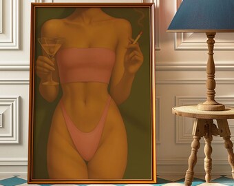 May include: A framed artwork depicts a figure in a pink bikini top and bottoms, holding a martini glass and a lit cigarette. The artwork has a gold frame and a green background. The artwork is displayed on a blue and white checkered floor.