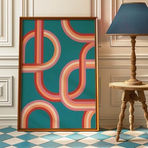 May include: A framed abstract art print with a teal background and colorful curved lines in shades of pink, orange, and red.