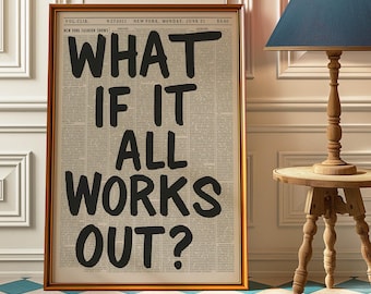 May include: Framed artwork with the text "WHAT IF IT ALL WORKS OUT?" in bold black letters. The background resembles a newspaper page. The frame is a warm gold color. The artwork is displayed in a room with a blue and white checkered floor.