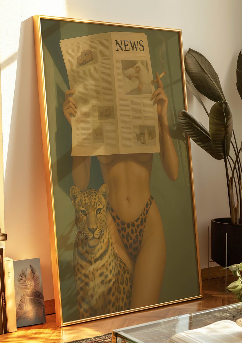 May include: Framed art print featuring a woman holding a newspaper with the headline "NEWS". A leopard stands beside her. The woman wears leopard print bottoms and holds a lit cigarette. The artwork has a gold frame.