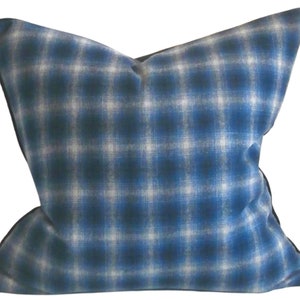 May include: Blue and white checked cushion with a black border.
