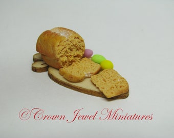 1:12 Easter Bread With Dyed Eggs on a Carrot cutting board by IGMA Artisan Robin Brady-Boxwell - Crown Jewel Miniatures