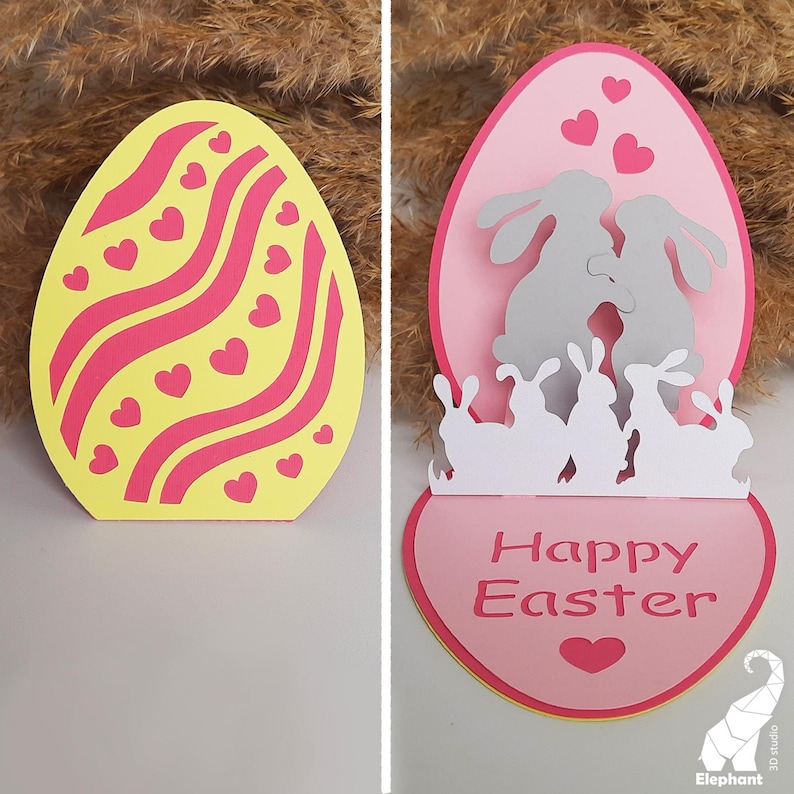 May include: A pink and yellow Easter egg card with a pop-up design featuring a couple of bunnies and the text "Happy Easter".