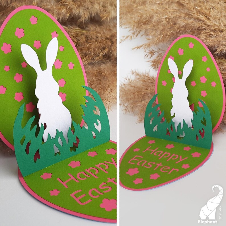 May include: A green and pink paper Easter card with a pop-up bunny silhouette. The card reads "Happy Easter" in white lettering.