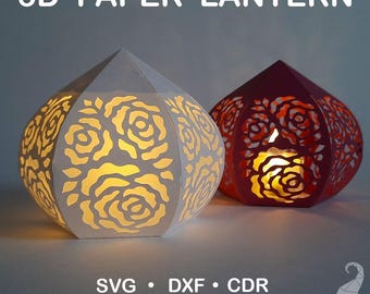 May include: Two 3D paper lanterns, one white and one burgundy, with rose-shaped cutouts. The white lantern is lit from within, casting a warm glow. The text "3D PAPER LANTERN" is at the top. Below are file format options.